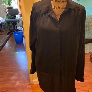 Black nylon woman’s top buttons up the front